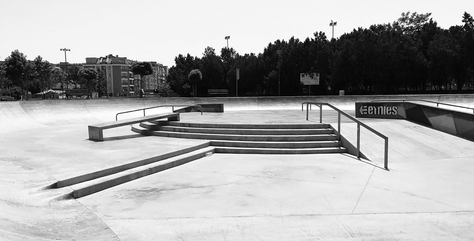Concrete street plaza with stair sets, handrails, ledges and banked walls