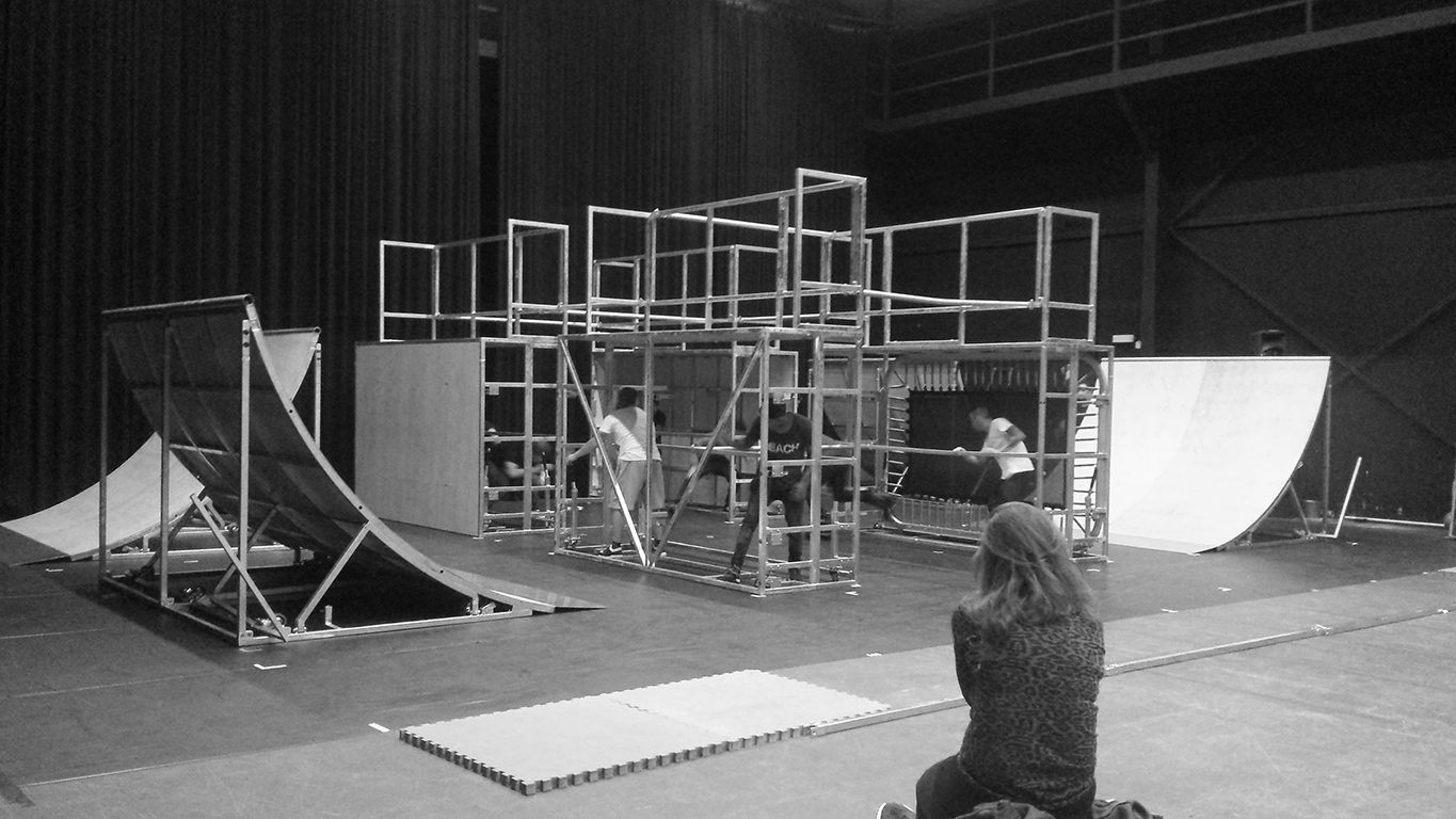 Indoor build of portable steel-frame ramps and scaffolding structures for an event